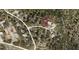 Aerial view showcasing a residential lot in a quiet neighborhood at 704 Village Ct, Fruitland Park, FL 34731