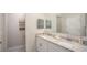 Double vanity bathroom with a spacious layout and modern finishes at 704 Village Ct, Fruitland Park, FL 34731