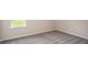 Bright bedroom featuring neutral walls and grey carpeting at 704 Village Ct, Fruitland Park, FL 34731