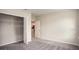 Spacious bedroom with walk-in closet and neutral carpeting at 704 Village Ct, Fruitland Park, FL 34731