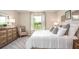 Spacious bedroom with plush bedding and ample closet space at 704 Village Ct, Fruitland Park, FL 34731