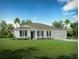 Single-story home with a two-car garage and a well-manicured lawn at 704 Village Ct, Fruitland Park, FL 34731