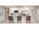 Modern kitchen featuring stainless steel appliances and an island with seating at 704 Village Ct, Fruitland Park, FL 34731
