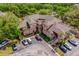 Community aerial view featuring manicured grounds, parking, and inviting residential buildings at 478 N Pin Oak Pl # 308, Longwood, FL 32779