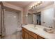Well-lit bathroom featuring a tub with shower at 478 N Pin Oak Pl # 308, Longwood, FL 32779