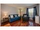 Comfortable living room featuring a blue sofa and chair at 478 N Pin Oak Pl # 308, Longwood, FL 32779