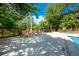 Inviting pool deck area with lounge chairs and lush surroundings for relaxing by the pool at 478 N Pin Oak Pl # 308, Longwood, FL 32779