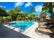 Inviting community pool with lounge chairs for relaxing and soaking up the sun at 478 N Pin Oak Pl # 308, Longwood, FL 32779