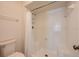 All-white shower and toilet with storage at 478 N Pin Oak Pl # 308, Longwood, FL 32779
