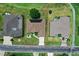 Aerial view outlining property with solar panels, a paved driveway, and verdant landscaping at 2172 Nw 50Th Cir, Ocala, FL 34482