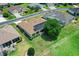 Aerial view of the home with solar panels, well-manicured lawn, and mature landscaping at 2172 Nw 50Th Cir, Ocala, FL 34482