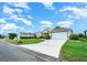 Desirable neighborhood features well-maintained homes with pristine landscaping and attached garages at 2172 Nw 50Th Cir, Ocala, FL 34482