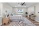 Bright bedroom featuring a ceiling fan, water view window, and stylish zebra print rug at 4790 Anderson Rd, Orlando, FL 32812