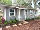 Charming renovated cottage with fresh gray paint, landscaping, and curb appeal at 4790 Anderson Rd, Orlando, FL 32812