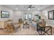 Bright living room with modern furniture, decorative art, and view of the lake at 4790 Anderson Rd, Orlando, FL 32812