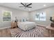 Bright main bedroom with modern furniture, decor, and a beautiful lake view at 4790 Anderson Rd, Orlando, FL 32812