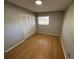 Bright bedroom with wood floor, closet and natural light from the window at 2308 Lake Helen Osteen Rd, Deltona, FL 32738