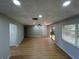 Living room featuring wood-look floors, recessed lighting, ceiling fan and slider to the outside at 2308 Lake Helen Osteen Rd, Deltona, FL 32738