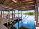 This dock has a hammock, bar area, and ladder to access the water at 1911 Lake Markham Preserve Trl, Sanford, FL 32771