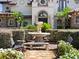 Charming home exterior with a front yard fountain, lush green hedges, and a stone walkway at 1911 Lake Markham Preserve Trl, Sanford, FL 32771