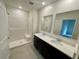 Double vanity bathroom with a large shower and modern fixtures at 3122 Kumquat Dr, Edgewater, FL 32141