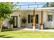 Inviting front entrance with modern lighting, stylish columns, and well-manicured landscaping enhancing curb appeal at 1305 W Lake Mary Blvd, Lake Mary, FL 32746