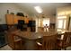 Kitchen showcasing granite countertops, wooden cabinets, and an open concept design at 1201 Thornbury Ct, Winter Garden, FL 34787