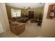 Cozy living room with plush furniture, including a large sectional sofa at 1201 Thornbury Ct, Winter Garden, FL 34787
