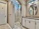 Modern bathroom with glass shower and granite vanity at 251 Silver Maple Rd, Groveland, FL 34736