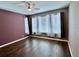 Bedroom featuring hardwood floors, neutral walls, and ample sunlight at 251 Silver Maple Rd, Groveland, FL 34736