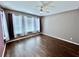 Bedroom featuring hardwood floors, neutral walls, and ample sunlight at 251 Silver Maple Rd, Groveland, FL 34736