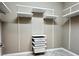 Walk-in closet featuring shelving and drawers for optimal storage and organization at 251 Silver Maple Rd, Groveland, FL 34736