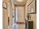 Inviting foyer featuring neutral colors, tile flooring, a white front door, and decorative accents at 251 Silver Maple Rd, Groveland, FL 34736