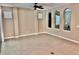 Spacious living room featuring neutral paint and tile flooring, offering a clean and modern design at 251 Silver Maple Rd, Groveland, FL 34736