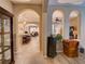 Open-concept living spaces showcasing archways, tile flooring, kitchen island, and dining area at 251 Silver Maple Rd, Groveland, FL 34736