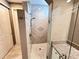 Walk-in shower featuring a glass door, tile surround with a decorative pattern and modern shower head at 251 Silver Maple Rd, Groveland, FL 34736