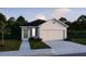 Lovely single-story home with a two-car garage, front lawn, and a welcoming front door at 2767 San Marco Way, Winter Haven, FL 33884