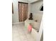 This bathroom features a large tub and shower with a floral curtain at 4436 Yachtmans Ct, Orlando, FL 32812
