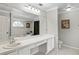 Primary bathroom featuring a long white vanity and a large mirror at 4436 Yachtmans Ct, Orlando, FL 32812