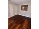 Cozy bedroom with neutral walls, closet, and hardwood flooring at 4436 Yachtmans Ct, Orlando, FL 32812