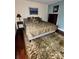Cozy bedroom featuring plush bedding, accent wall, and decorative rug at 4436 Yachtmans Ct, Orlando, FL 32812