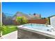 Backyard featuring a hot tub, putting green and backyard fencing creates a private outdoor oasis at 4436 Yachtmans Ct, Orlando, FL 32812