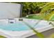 Luxurious hot tub surrounded by lush landscaping, creating a tranquil outdoor oasis at 4436 Yachtmans Ct, Orlando, FL 32812