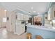 Bright kitchen featuring stainless steel appliances, breakfast bar, tile floors, and access to the dining room at 4436 Yachtmans Ct, Orlando, FL 32812