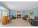 Comfortable living room with brick fireplace, bar, tile floors, and two plush leather recliners at 4436 Yachtmans Ct, Orlando, FL 32812