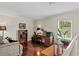 Loft space setup as a home office featuring hardwood floors and natural lighting at 4436 Yachtmans Ct, Orlando, FL 32812
