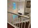 View of the staircase with wood treads, white risers and railing at 4436 Yachtmans Ct, Orlando, FL 32812