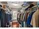 Walk-in closet with custom shelving and organization for clothing storage at 4436 Yachtmans Ct, Orlando, FL 32812