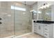 Walk-in shower with patterned tile and a built-in seat at 3018 Avalon Ridge Ln, Winter Garden, FL 34787