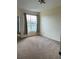 Bedroom featuring carpeted floors and a window with views of the community at 5500 Metrowest Blvd # 304, Orlando, FL 32811
